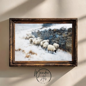 May include: A framed landscape painting depicts a flock of sheep walking through a snowy field next to a stone wall. The artwork is in a dark wooden frame and features a winter scene with muted colors.