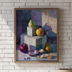 May include: A framed still life painting featuring a green pear, a yellow apple, and a red apple. The fruits are arranged on geometric blocks. Sliced apple pieces are scattered in the foreground. The artwork has a warm color palette.