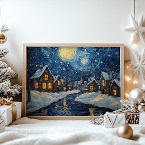 May include: A framed painting depicts a winter village scene under a starry night sky. The artwork features snow-covered houses with lit windows, a winding river, and a swirling yellow moon. The painting is in a wooden frame, surrounded by Christmas decorations.