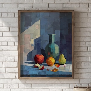 May include: A framed still life painting featuring a teal vase, red apple, orange, and green pear. The artwork has a blue background with a light and shadow effect. The painting is in a wooden frame.