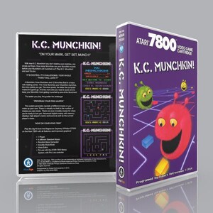 May include: A purple Atari 7800 video game cartridge box for K.C. Munchkin! featuring a red creature with antennae and a green creature on a grid background. The back displays game information, screenshots, and text about the maze gameplay.
