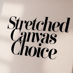 a white canvas with black lettering that reads stretched canvass choice