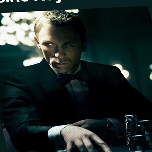 a man in a tuxedo playing a game of chess