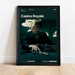 a poster of a man in a suit holding a gun