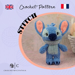 May include: A blue and light blue crocheted Stitch doll with peach-colored inner ears. The image includes the text "STITCH" and "Crochet Pattern". The doll is standing on a light pink surface. The Etsy shop name "CROCHETBYCYNTHIA" is also visible.