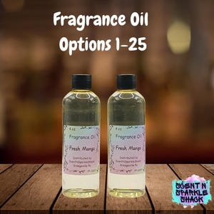 May include: Two clear 4 oz. fragrance oil bottles with black caps. Each bottle has a label that reads "Fragrance Oil Fresh Mango." The image also displays the text "Fragrance Oil Options 1-25."