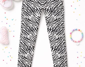 Dziewczęce legginsy z nadrukiem zebry • Czarno-białe spodnie ze wzorem zwierzęcym • Dziecięce legginsy do jogi