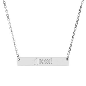 May include: A silver-colored necklace with a rectangular pendant. The pendant has the word "WICKED" engraved on it. The necklace chain is a delicate link style.