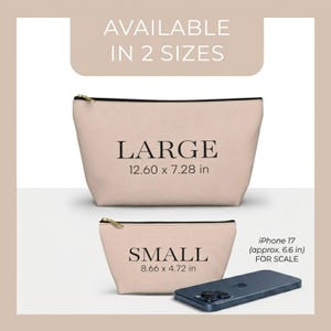 May include: Two beige zippered pouches, labeled "LARGE" (12.60 x 7.28 in) and "SMALL" (8.66 x 4.72 in), are displayed. The text "AVAILABLE IN 2 SIZES" is at the top. An iPhone 17 (approx. 6.6 in) is included for scale.