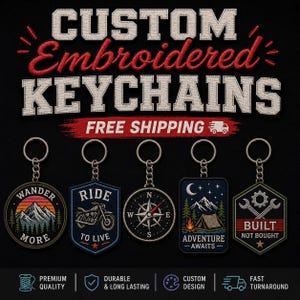May include: Five custom embroidered keychains with metal rings and chains. Designs include a mountain landscape with text WANDER MORE, a motorcycle with RIDE TO LIVE, a compass, a tent under stars with ADVENTURE AWAITS, and tools with BUILT NOT BOUGHT.