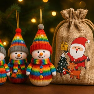 May include: Three snowman decorations with rainbow-striped knitted hats, scarves, and sweaters. A burlap gift bag with a Santa Claus graphic is to the right. The background is a blurred Christmas tree with bokeh lights.