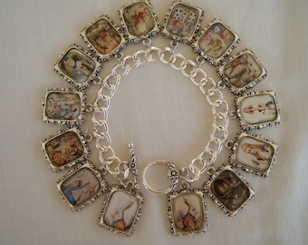 May include: A silver charm bracelet with 14 charms featuring illustrations from Alice in Wonderland. The charms are silver-toned with a white background and colorful illustrations.