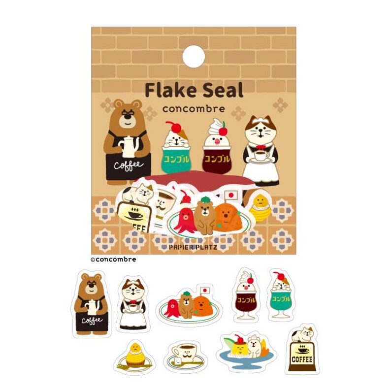 May include: A sheet of decorative stickers featuring various cartoon characters, including a bear, cat, and dogs, with coffee and dessert themes. The stickers are in a variety of colors, including brown, white, and red. The text "Flake Seal" and "concombre" are visible.