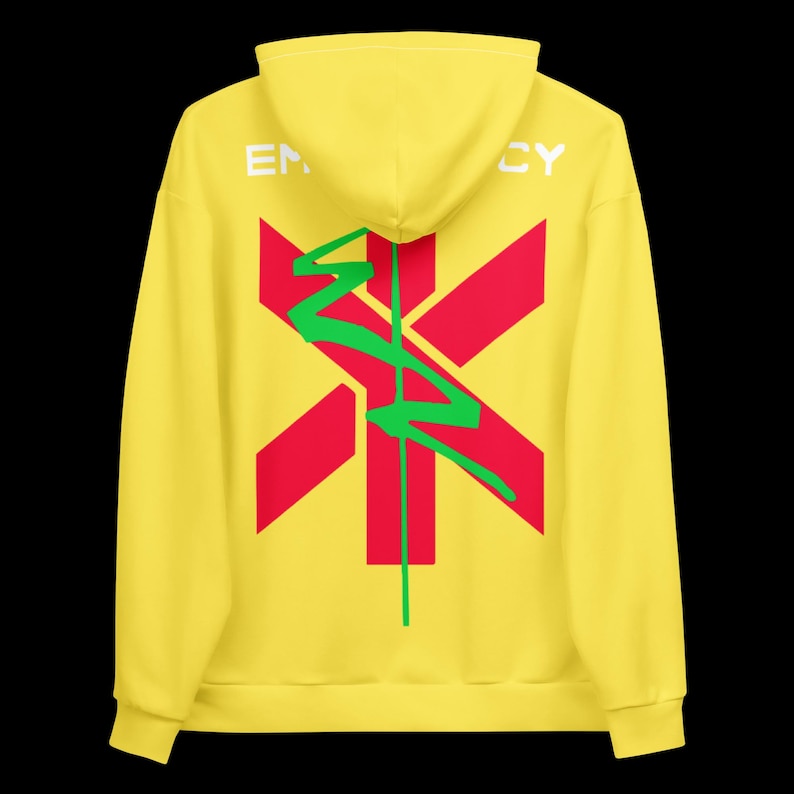 May include: Yellow hoodie with a red and green graphic design on the back. The design includes a red cross-like shape with a green, stylized lightning bolt. The word "EM...CY" is printed in white on the hood.