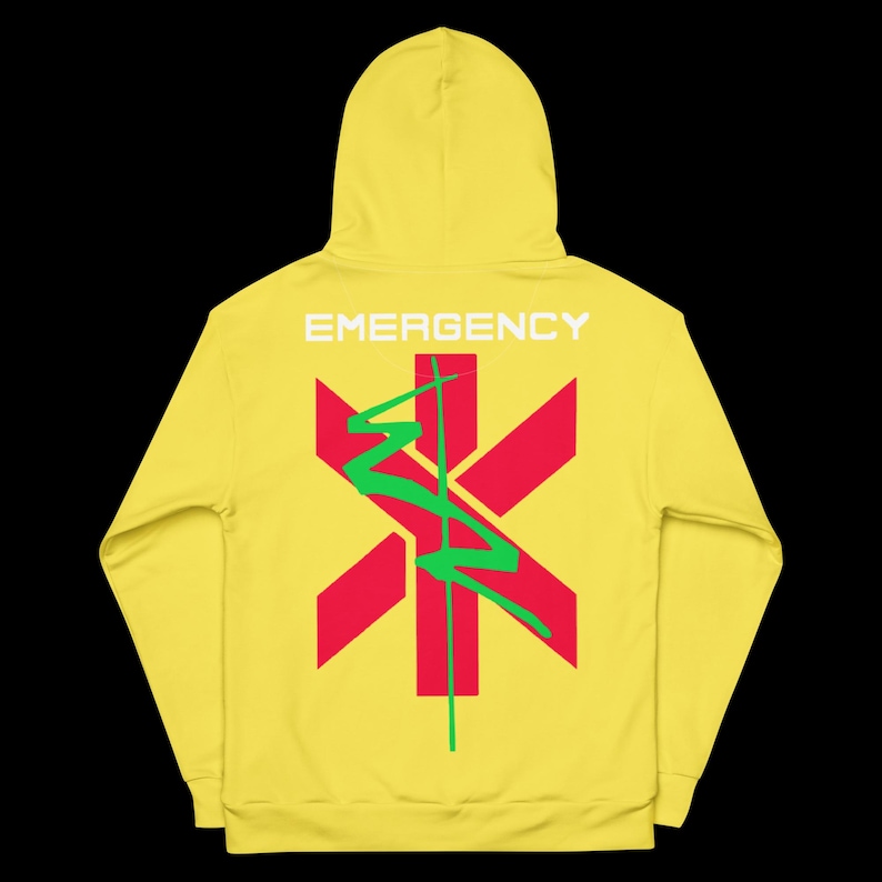 May include: Yellow hoodie with the word "EMERGENCY" printed across the shoulders. A red star of life symbol is centered on the back, with a green lightning bolt design. The hoodie has a hood and long sleeves.