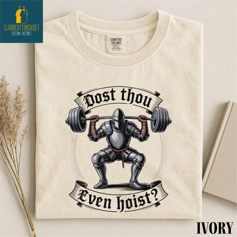 a t-shirt with a graphic design depicting a knight lifting a barbell, accompanied by the text "Do you even hoist?"