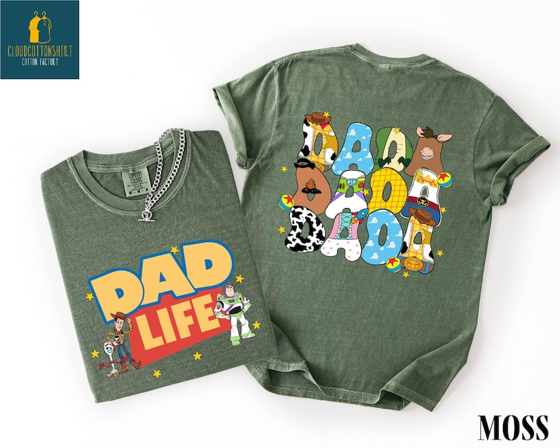 two green t-shirts with cartoon characters and text related to the theme of "DAD LIFE".
