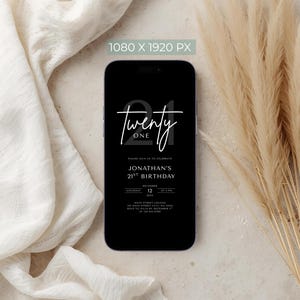 May include: A black smartphone displays a digital invitation for Jonathan's 21st birthday. The design features the number "21" and the word "twenty one" in white script. Additional details include the date, time, and location.