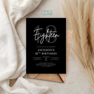 May include: A black 5x7 inch birthday invitation with white script that reads "Eighteen." The invitation includes details for Jackson's 18th birthday, including the date, time, and location. The invitation is on a brown envelope.