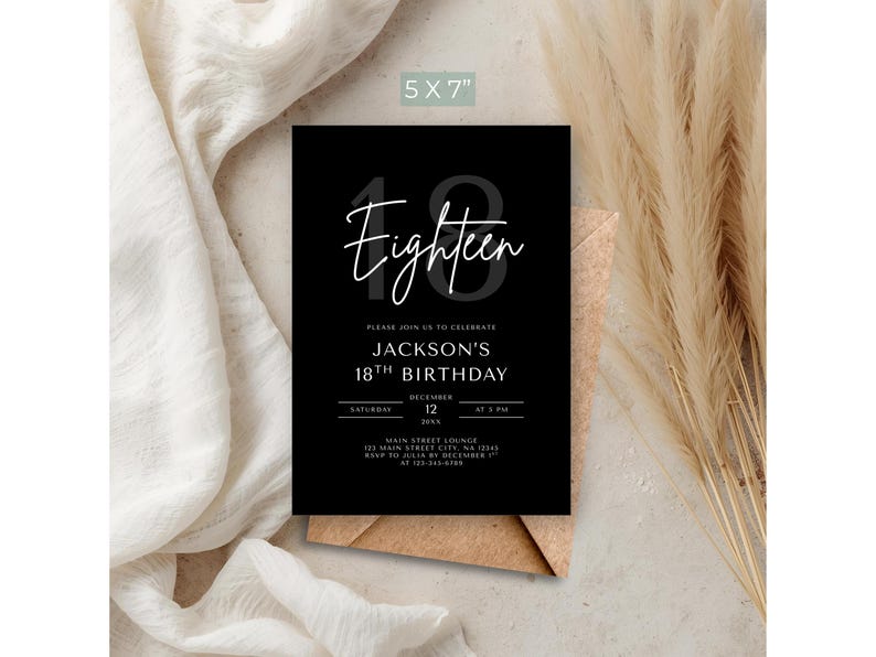 May include: A black 5x7 inch birthday invitation with white script that reads "Eighteen." The invitation includes details for Jackson's 18th birthday, including the date, time, and location. The invitation is on a brown envelope.