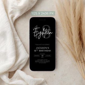 May include: A black smartphone displays a digital invitation for Jackson's 18th birthday. The invitation features white text on a black background, with the word "Eighteen" in a stylish font. The date and time are also included.