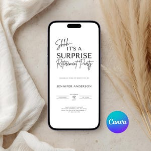 May include: A smartphone displays a white invitation for a surprise retirement party. The invitation text reads "Shhh... IT'S A SURPRISE Retirement Party" in a stylish font. The phone is set against a backdrop of cream fabric and dried plants.