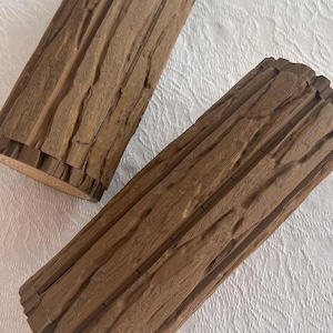 May include: A rustic wooden sign with the text "Welcome to our home" in white lettering. The sign features a distressed finish and a simple, inviting design, perfect for entryway decor.