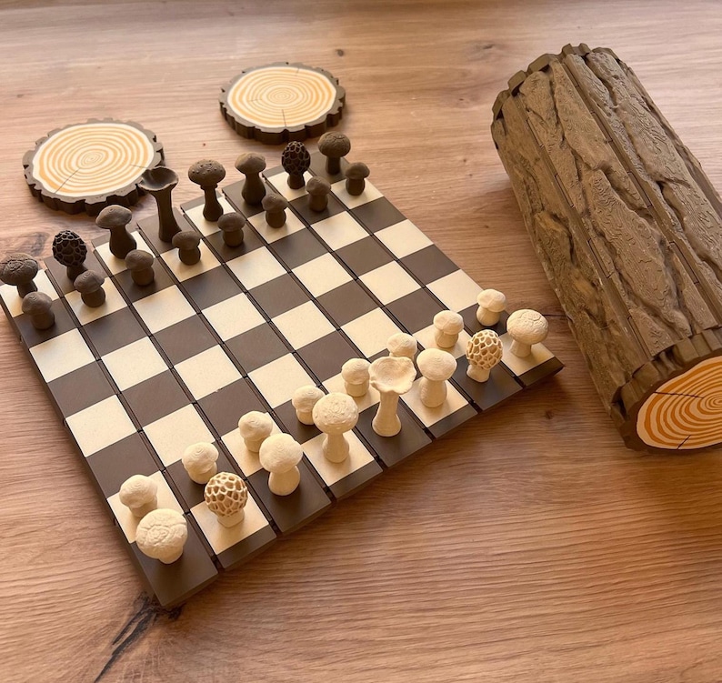 May include: A white ceramic mug with a black handle and the text "But First, Coffee" in a bold, black font. The mug is set against a blurred background, suggesting a cozy setting. The mug appears to be approximately 4 inches tall.