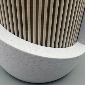 Alt text:
Close up of ribbed Japandi planter texture showing modern 3D printed design and integrated drip tray base.