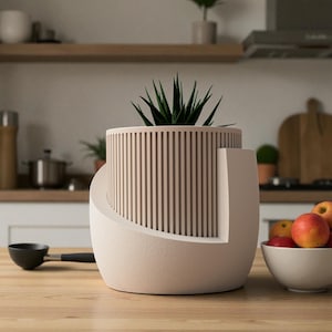 May include: A cylindrical planter with a vertical slat design in a light beige color, featuring a smooth, curved outer shell that partially wraps around the base. A dark green succulent plant is potted inside the center of the planter.