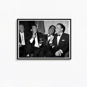 May include: Black and white framed photograph featuring five men in formal attire, laughing and smoking. The men are wearing tuxedos, suits, and bow ties. The photograph is a vintage style, capturing a candid moment.
