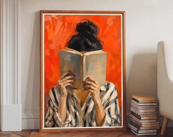 May include: A framed oil painting depicting a person with dark hair in a bun, wearing a white and black striped shirt, holding an open book in front of their face. The background is a vibrant, textured orange, and the person has red fingernails.