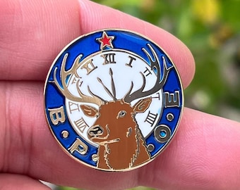 Elks BPOE reversspeld met kloklogo