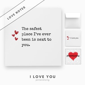 May include: A square white greeting card featuring the black text The safest place I've ever been is next to you and three small red hearts. Includes a matching white envelope and a small square card with the text I love you and a red heart.