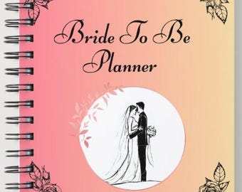May include: A spiral-bound planner with a pink and yellow gradient cover. The cover has the text "Bride To Be Planner", an illustration of a couple, and floral corner accents.
