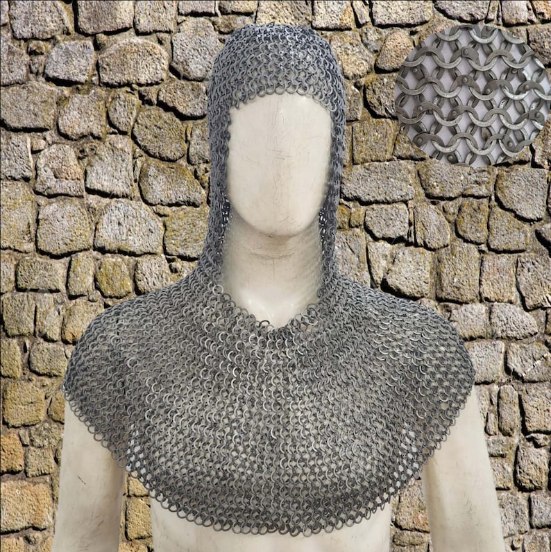 May include: A silver chainmail coif, a hood and shoulder covering made of interlocking metal rings. The coif is displayed on a mannequin against a stone wall background. A close-up inset shows the chainmail weave.