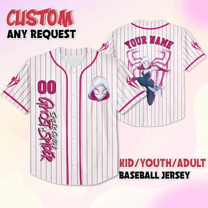May include: White baseball jersey with pink pinstripes, featuring a Ghost Spider design. The front displays the number "00" and the text "Ghost Spider". The back has a Spider-Gwen graphic and space for a name. Text at the top says "CUSTOM ANY REQUEST".