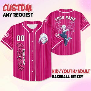 May include: A pink baseball jersey with white pinstripes, featuring the text "CUSTOM ANY REQUEST" at the top. The front displays the number "00" and "GHOST SPIDER" text. The back has "YOUR NAME" and a Spider-Gwen graphic. The text "KID/YOUTH/ADULT BASEBALL JERSEY" is at the bottom.