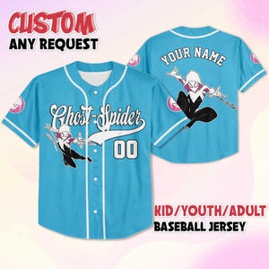 May include: Light blue baseball jersey with white accents, featuring "Ghost-Spider" text and the number "00". The jersey has a graphic of Ghost-Spider and the text "YOUR NAME" on the back. The text "CUSTOM ANY REQUEST" and "KID/YOUTH/ADULT BASEBALL JERSEY" are also visible.