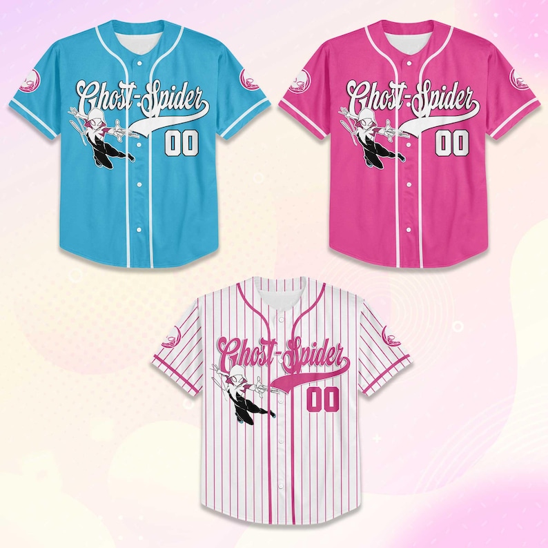 May include: Three baseball jerseys in the image. One is light blue, one is pink, and the third is white with pink pinstripes. Each jersey has the words "Ghost-Spider" and the number "00" on the front, along with a graphic of the character.