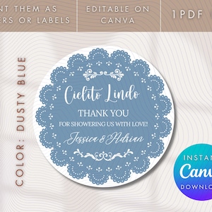 May include: Dusty blue round sticker with a decorative lace-like border. The text reads "Cielito Lindo, Thank You, For Showering Us With Love!" with the names Jessica & Adrian. Includes "Print them as stickers or labels" and "Editable on Canva".