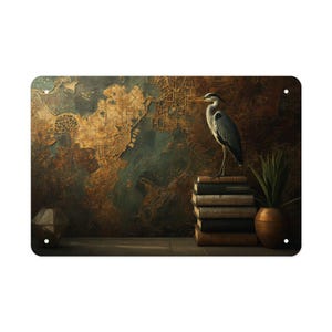 May include: Metal wall art featuring a heron standing on a stack of books. The background displays a vintage map design in shades of brown and blue. A small potted plant and a geometric object are also visible.