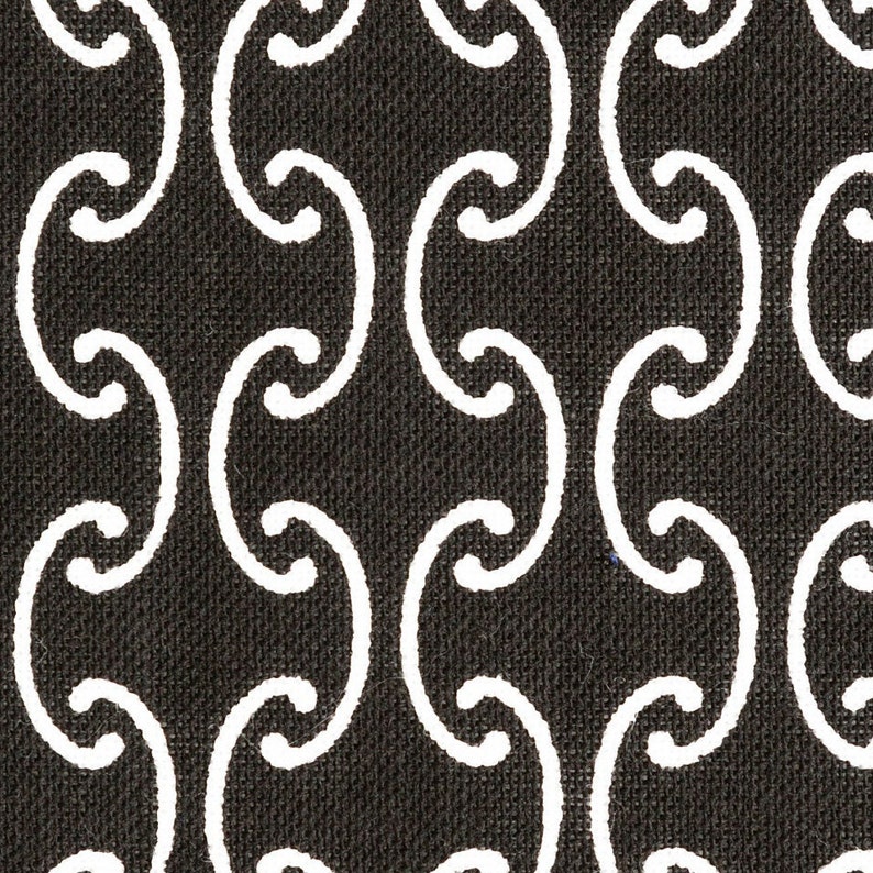 May include: Black and white fabric with a repeating pattern of curved lines forming a geometric design.