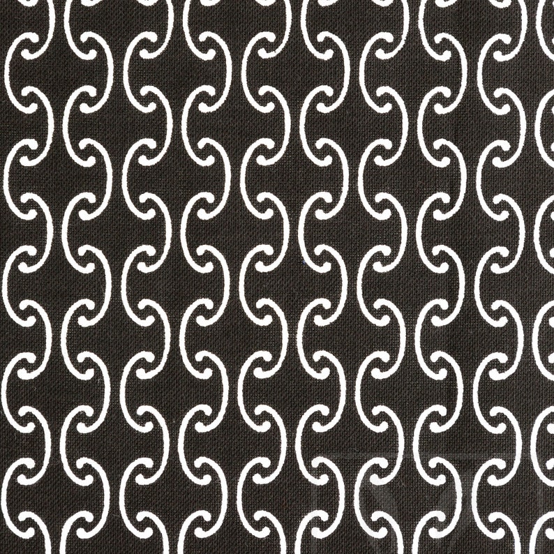 May include: A black and white fabric with a repeating pattern of interlocking circles. The circles are white and the background is black.