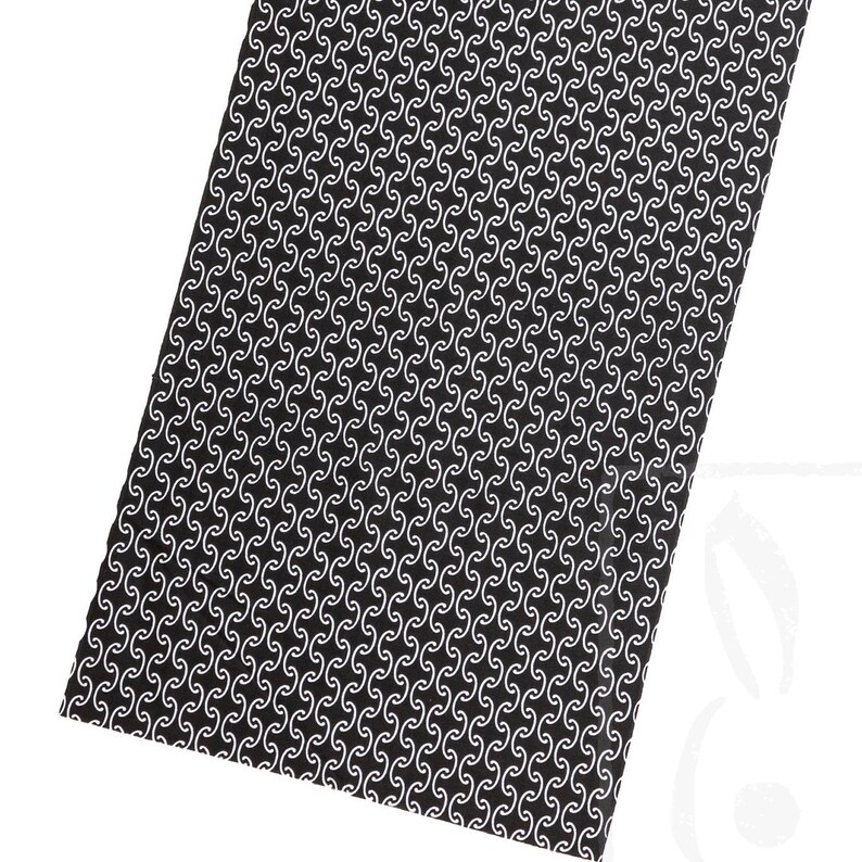 May include: Black fabric with a white repeating pattern of curved lines.