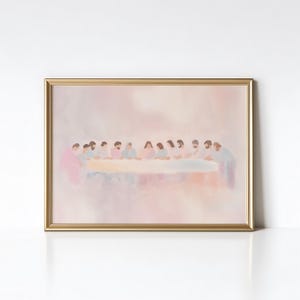 May include: A framed print depicting a watercolor-style illustration of a group of people seated at a table. The artwork features soft pastel colors, with a gold-colored frame. The scene is a religious depiction.