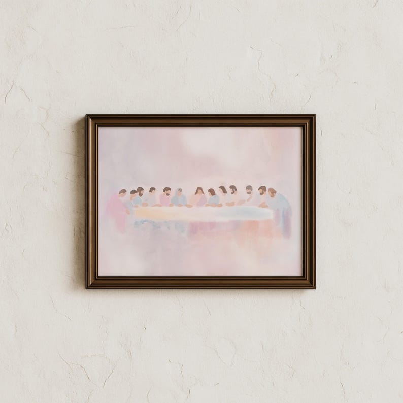 May include: A framed watercolour print showing a group of figures seated around a long table. The artwork uses soft pastel colours, with the figures and table as the focal point. The frame is a dark brown colour.