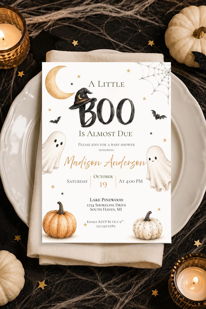 May include: A rectangular baby shower invitation card featuring a watercolor design with a crescent moon, a witch hat, two ghosts, a spider web, bats, and two pumpkins. The text reads A LITTLE BOO IS ALMOST DUE, honoring Madison Anderson, October 19.