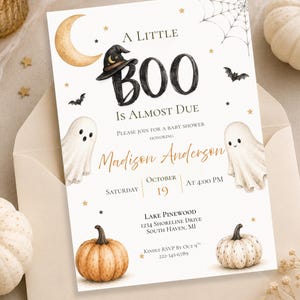 May include: A rectangular baby shower invitation card featuring a watercolor design with a crescent moon, a witch hat, two ghosts, two pumpkins, a spider web, and stars. The text reads A LITTLE BOO IS ALMOST DUE, honoring Madison Anderson, Saturday October 19 at 4:00 PM, Lake Pinewood, 1234 Shoreline Drive, South Haven, MI, and RSVP by Oct 9.