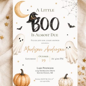 May include: A rectangular baby shower invitation card featuring watercolor illustrations of two ghosts, two pumpkins, a crescent moon, a spider web, and a witch hat. The text reads A LITTLE BOO IS ALMOST DUE, PLEASE JOIN FOR A BABY SHOWER HONORING Madison Anderson, SATURDAY OCTOBER 19 AT 4:00 PM, LAKE PINEWOOD 1234 SHORELINE DRIVE SOUTH HAVEN, MI, KINDLY RSVP BY OCT 9TH 222-345-6789.